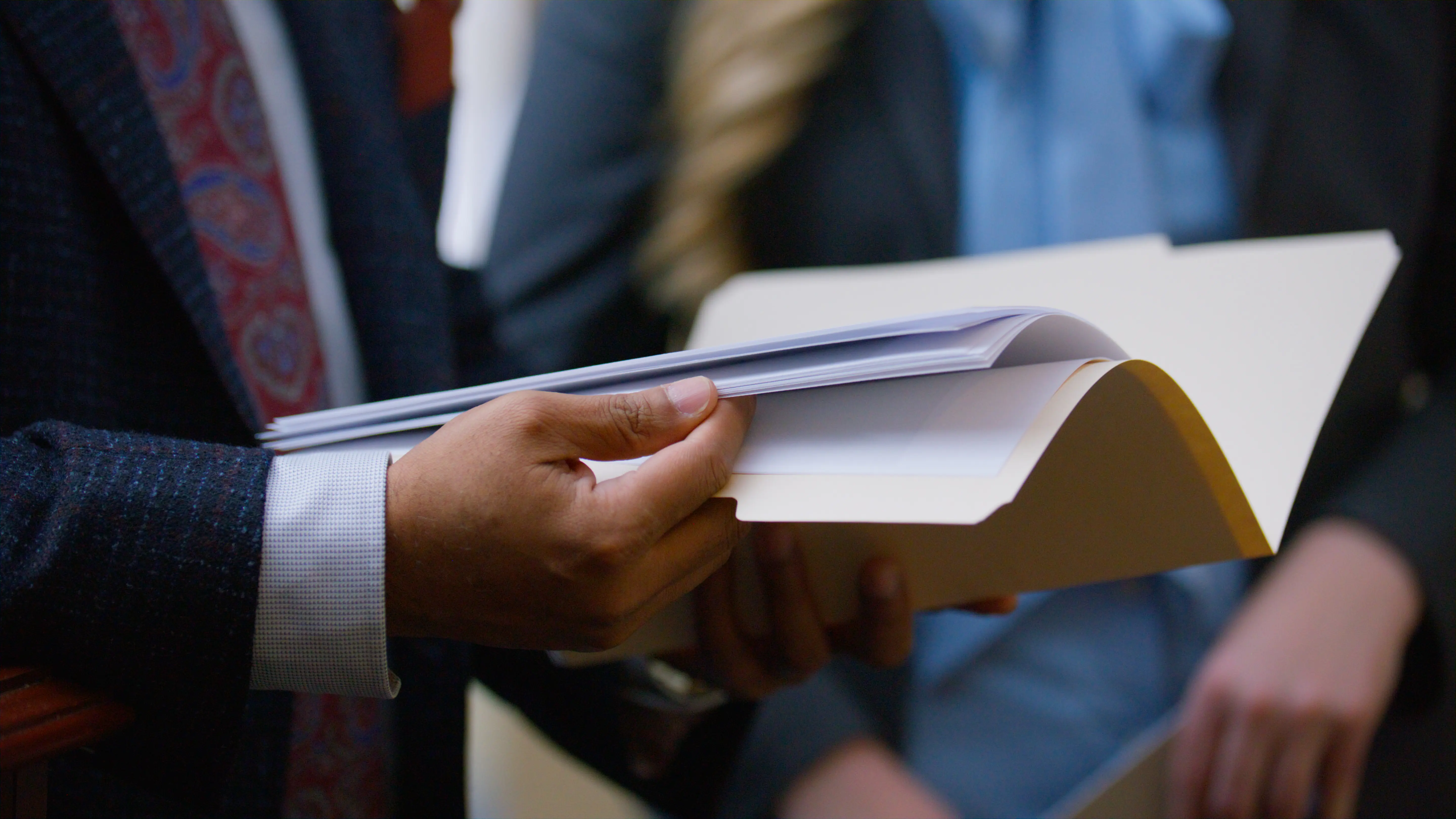 Happy young family of three walking through a garden.